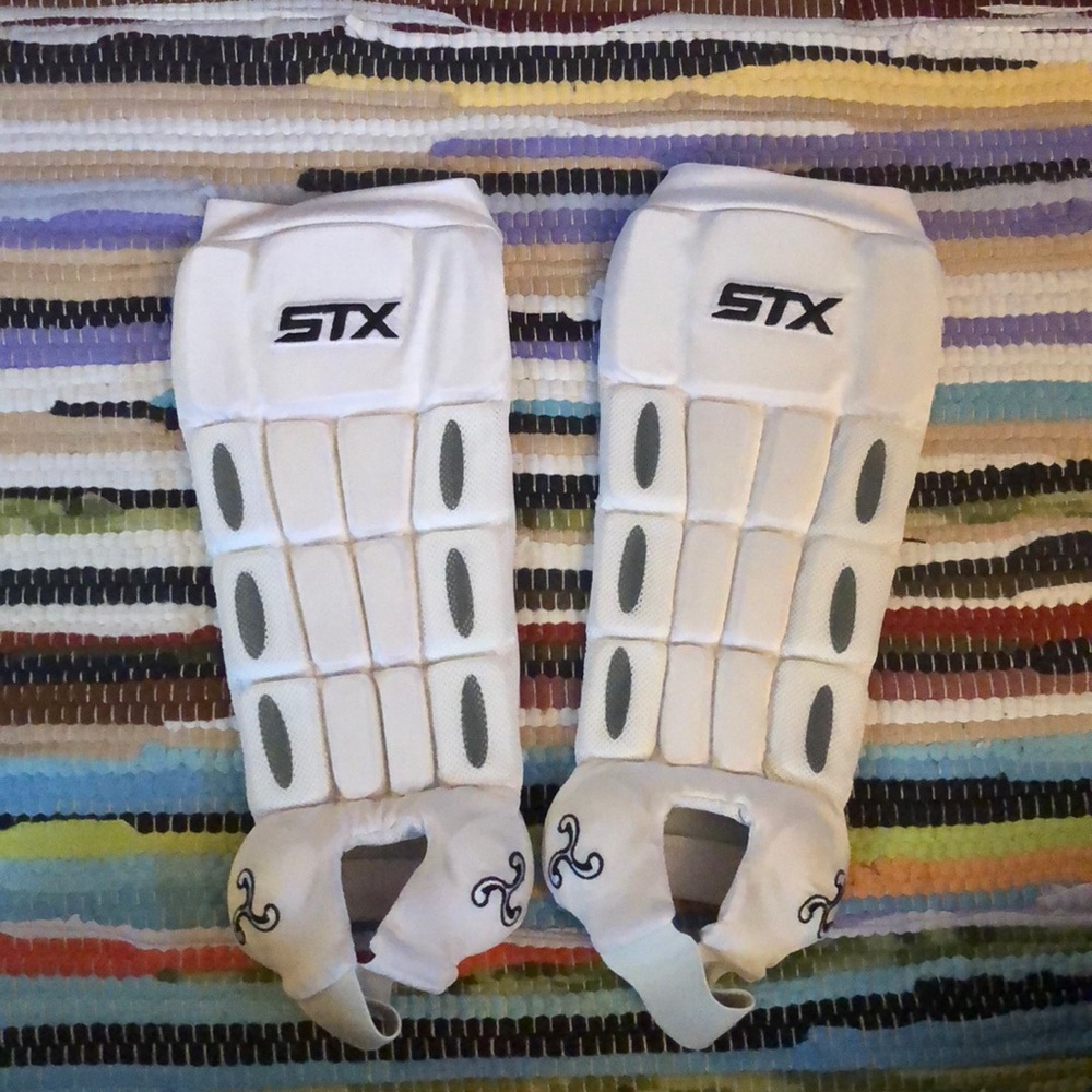 White field hockey/ lacrosse shin guards